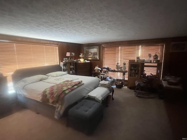 bedroom with carpet flooring and a textured ceiling