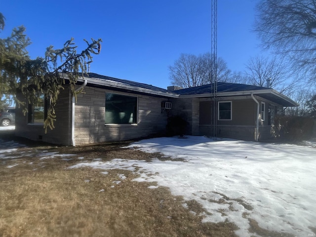 view of snow covered house