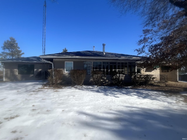 view of snow covered house