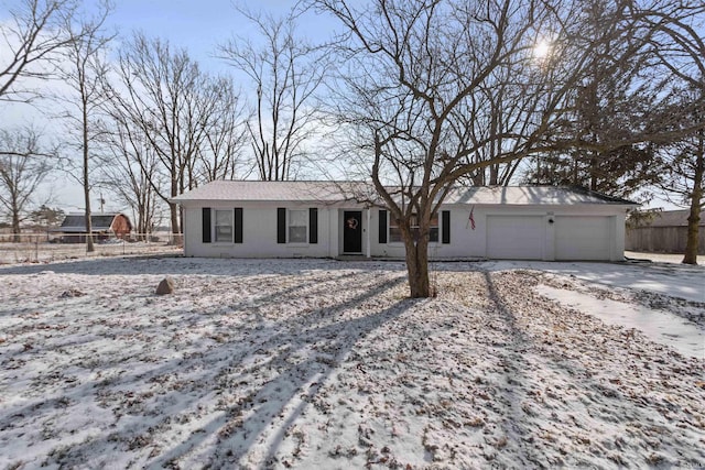 single story home with a garage