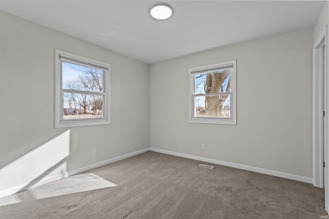 unfurnished bedroom featuring light carpet