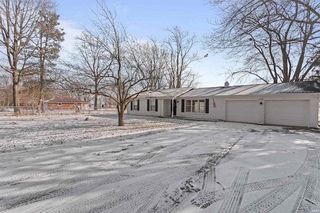 view of front of property with a garage