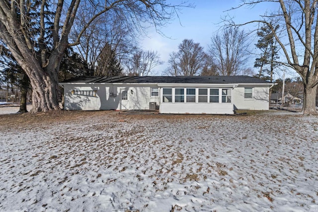 view of front of property featuring a sunroom