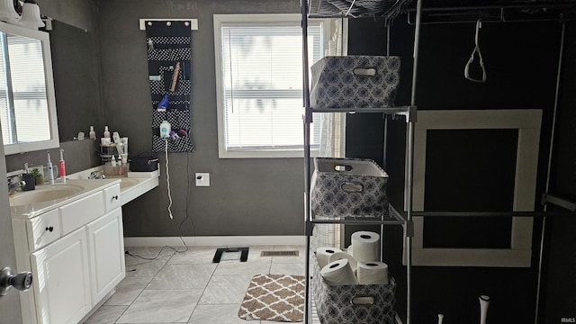 bathroom featuring tile patterned floors and vanity