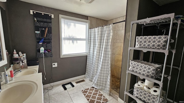 bathroom with vanity, tile patterned floors, and a shower with curtain