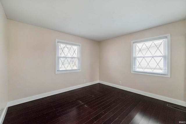 unfurnished room featuring hardwood / wood-style flooring