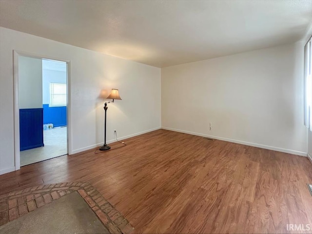 spare room featuring hardwood / wood-style floors