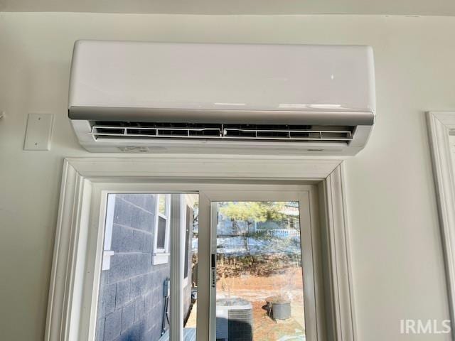 interior details featuring a wall unit AC and central air condition unit