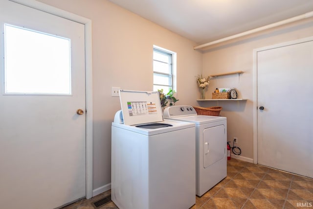 washroom with separate washer and dryer