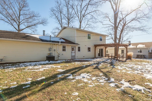 rear view of property featuring cooling unit and a pergola