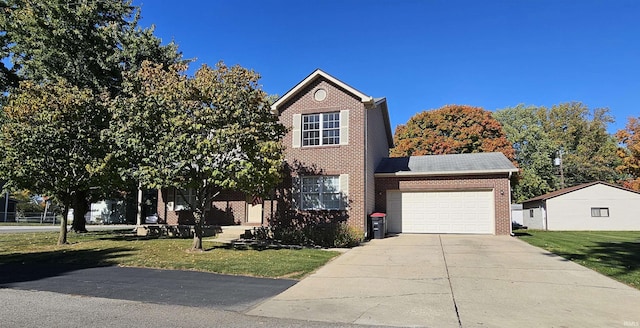 view of front property featuring a garage and a front yard