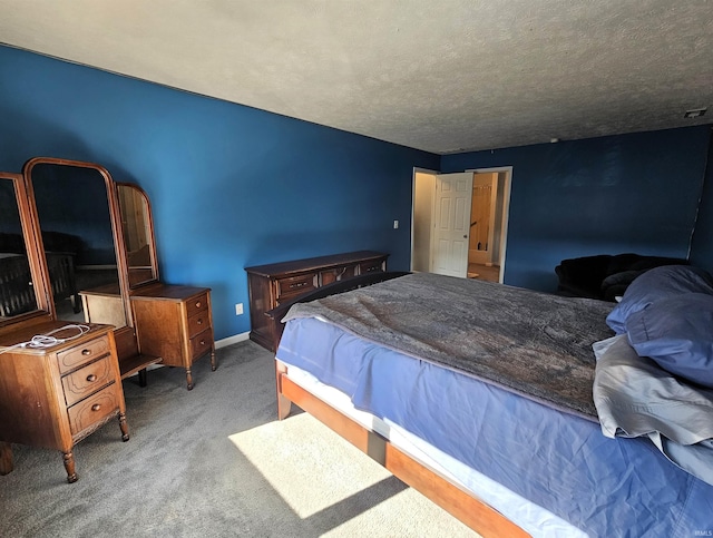 carpeted bedroom featuring a textured ceiling