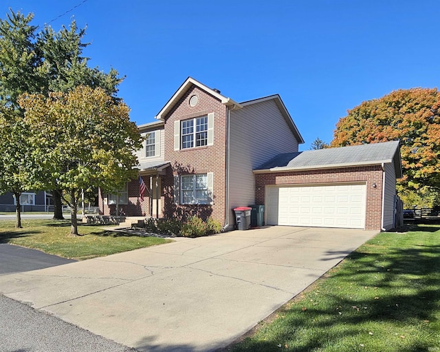 view of front property featuring a garage and a front yard