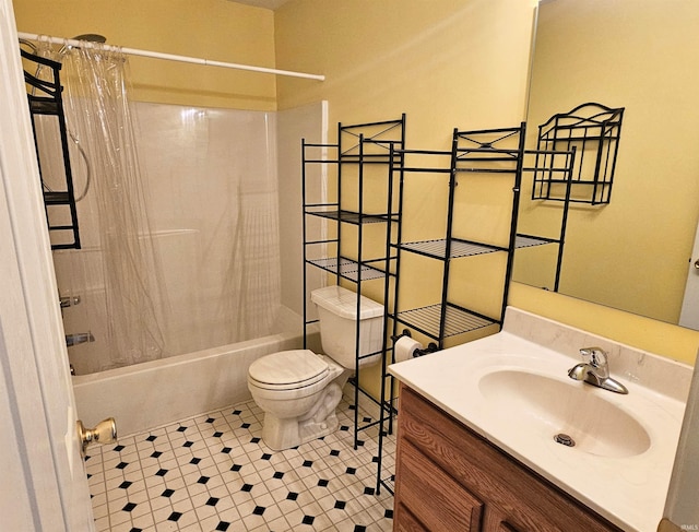 full bathroom with shower / bath combo, vanity, tile patterned floors, and toilet