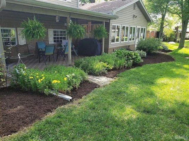 view of yard with a sunroom