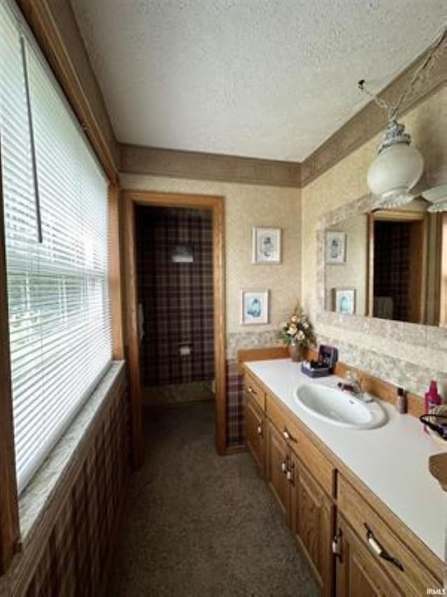 bathroom with vanity and a textured ceiling