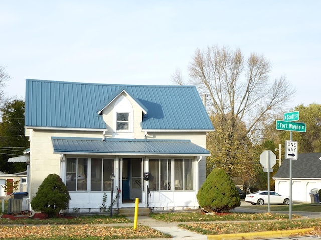 view of front of home with a sunroom