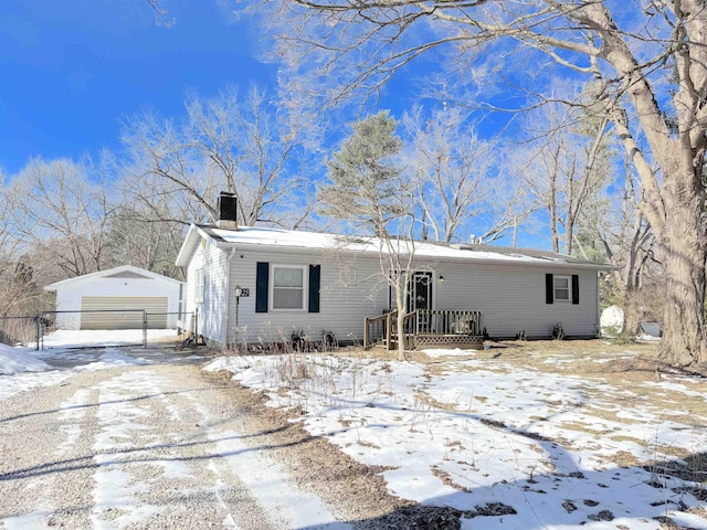 view of front of property with an outbuilding and a garage