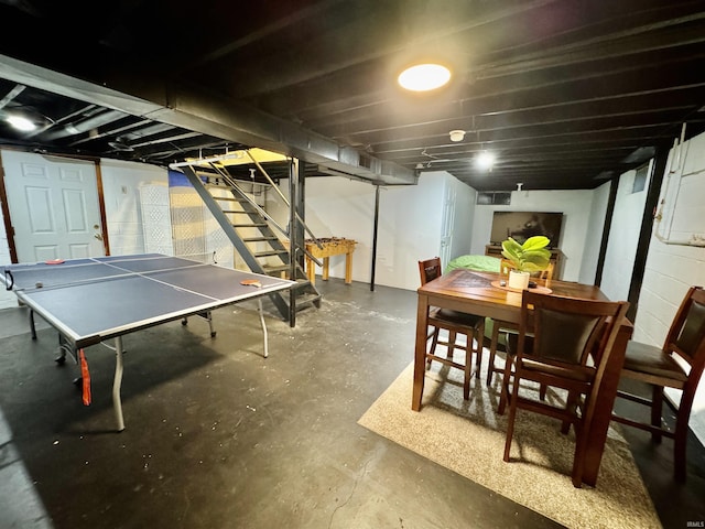 recreation room with concrete flooring