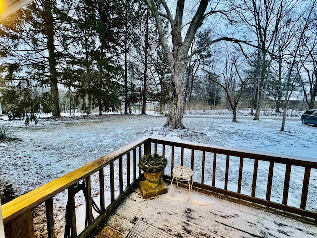 view of snow covered deck