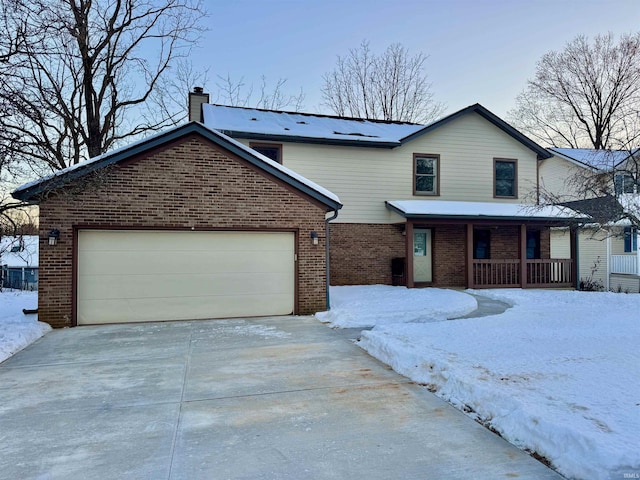 view of front of house featuring a garage and covered porch