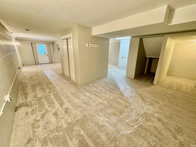 hallway with a textured ceiling