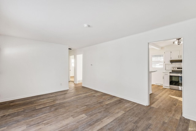 unfurnished room featuring hardwood / wood-style flooring