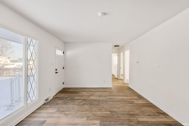 spare room featuring hardwood / wood-style floors