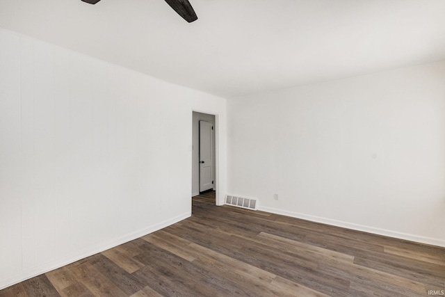 unfurnished room with dark wood-type flooring and ceiling fan