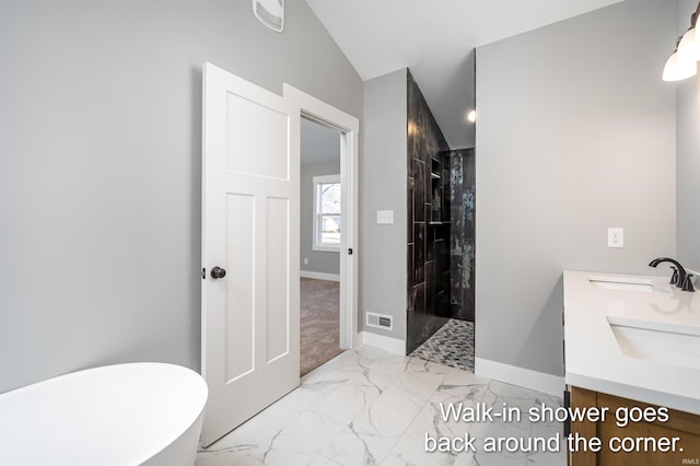 bathroom with vanity, vaulted ceiling, and independent shower and bath