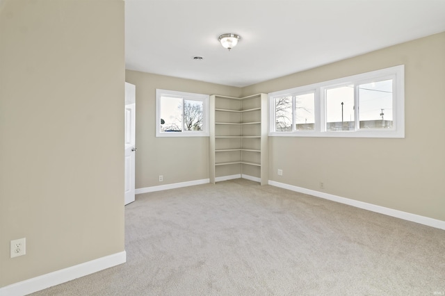 empty room featuring light colored carpet