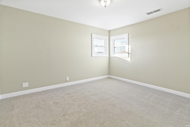 spare room featuring carpet floors