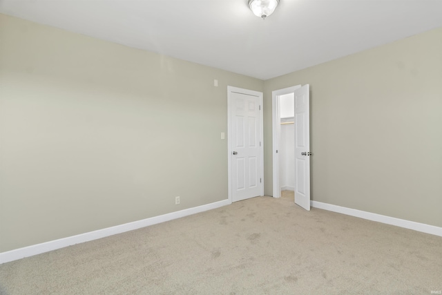 empty room with light colored carpet