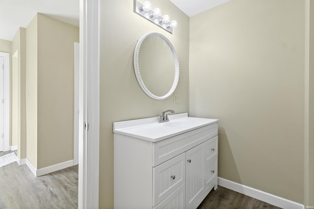 bathroom featuring vanity and hardwood / wood-style floors