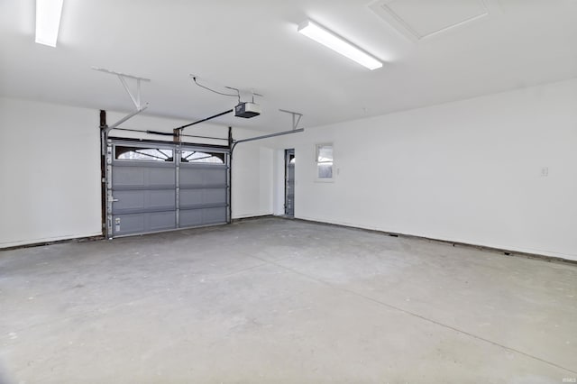 garage featuring a garage door opener