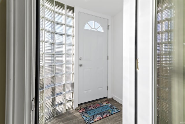 doorway with hardwood / wood-style flooring