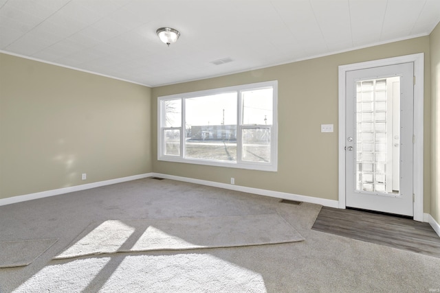 view of carpeted foyer