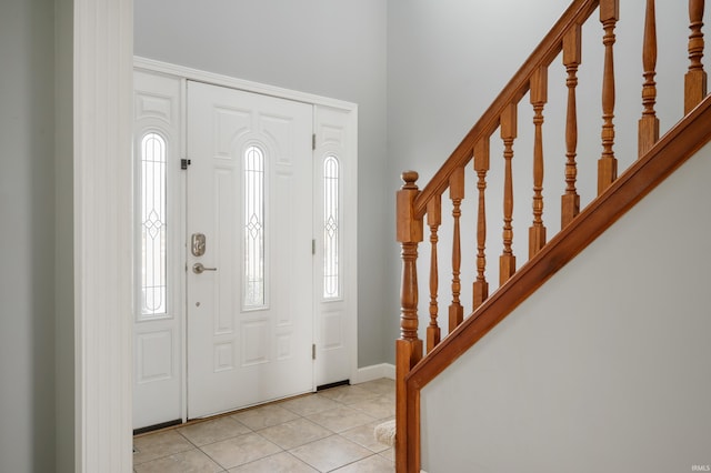 entrance foyer with light tile patterned flooring and a wealth of natural light