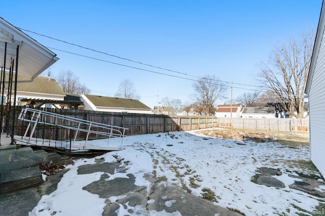 view of yard layered in snow