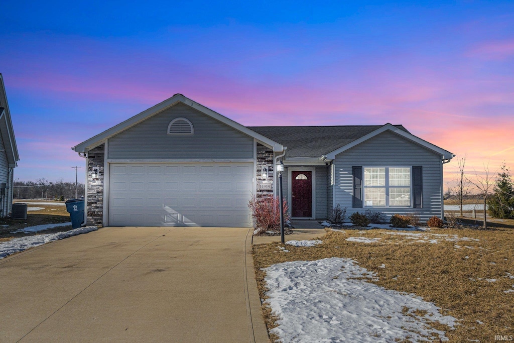 ranch-style home featuring a garage