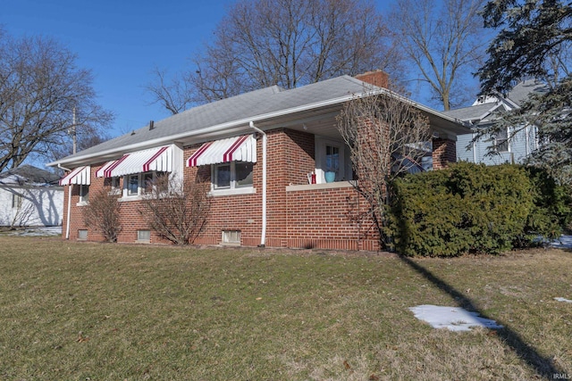 view of side of home featuring a yard