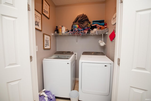 laundry area featuring washing machine and clothes dryer