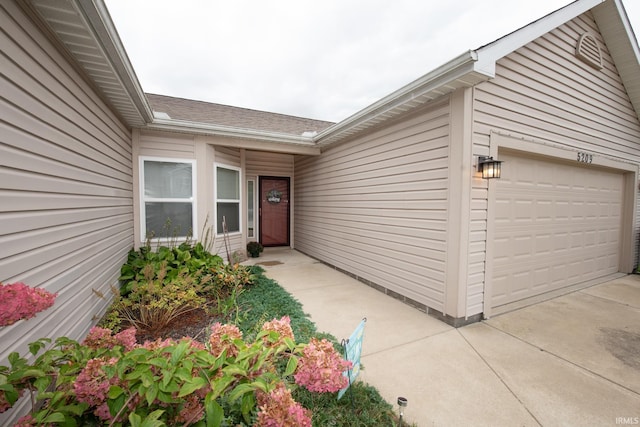 doorway to property featuring a garage