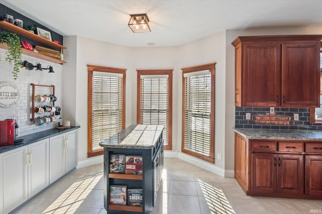 kitchen with decorative backsplash and light tile patterned flooring