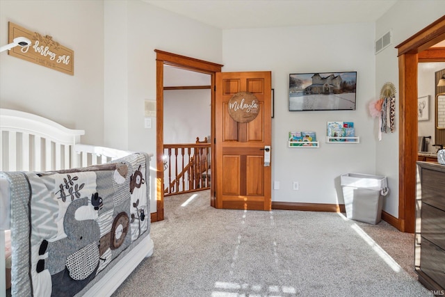 bedroom featuring a nursery area