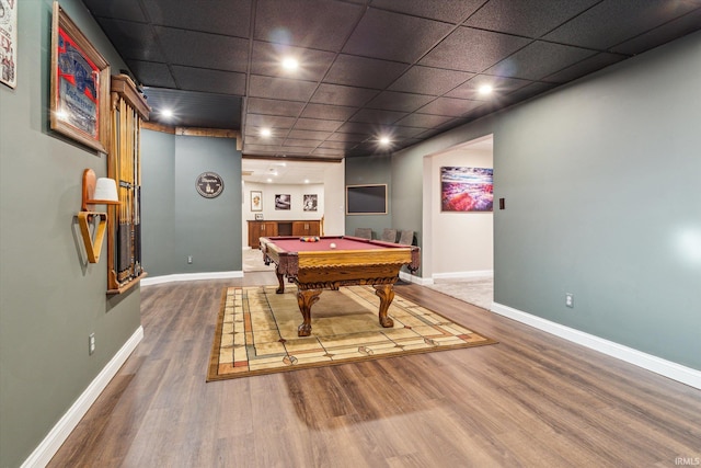 playroom featuring hardwood / wood-style flooring, pool table, and a paneled ceiling