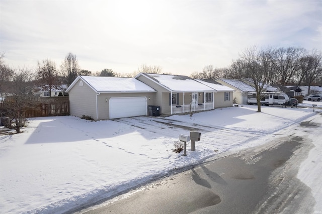 ranch-style home featuring a garage and central air condition unit