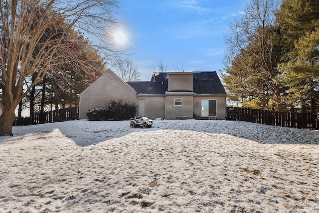 view of snow covered house