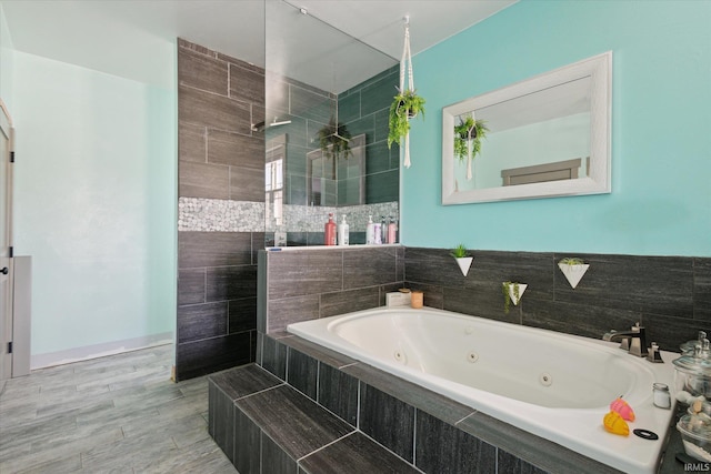 bathroom featuring separate shower and tub