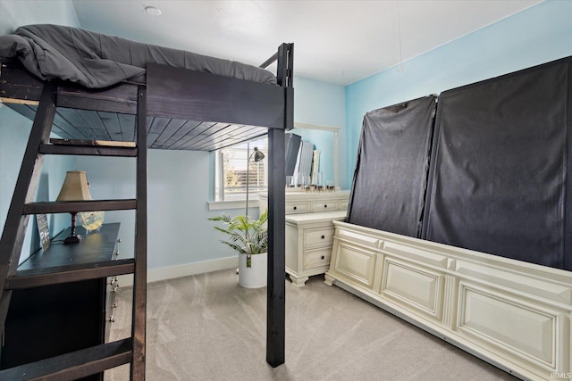 bedroom featuring light colored carpet